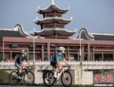【168资讯】体育赛事催“骑行热”升温 中国城市营造“骑行友好”环境